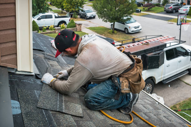 Professional Roofing technician working in Hedrick, IA